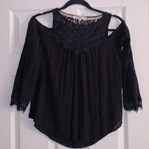 Open shoulder black sheer top with lace accents